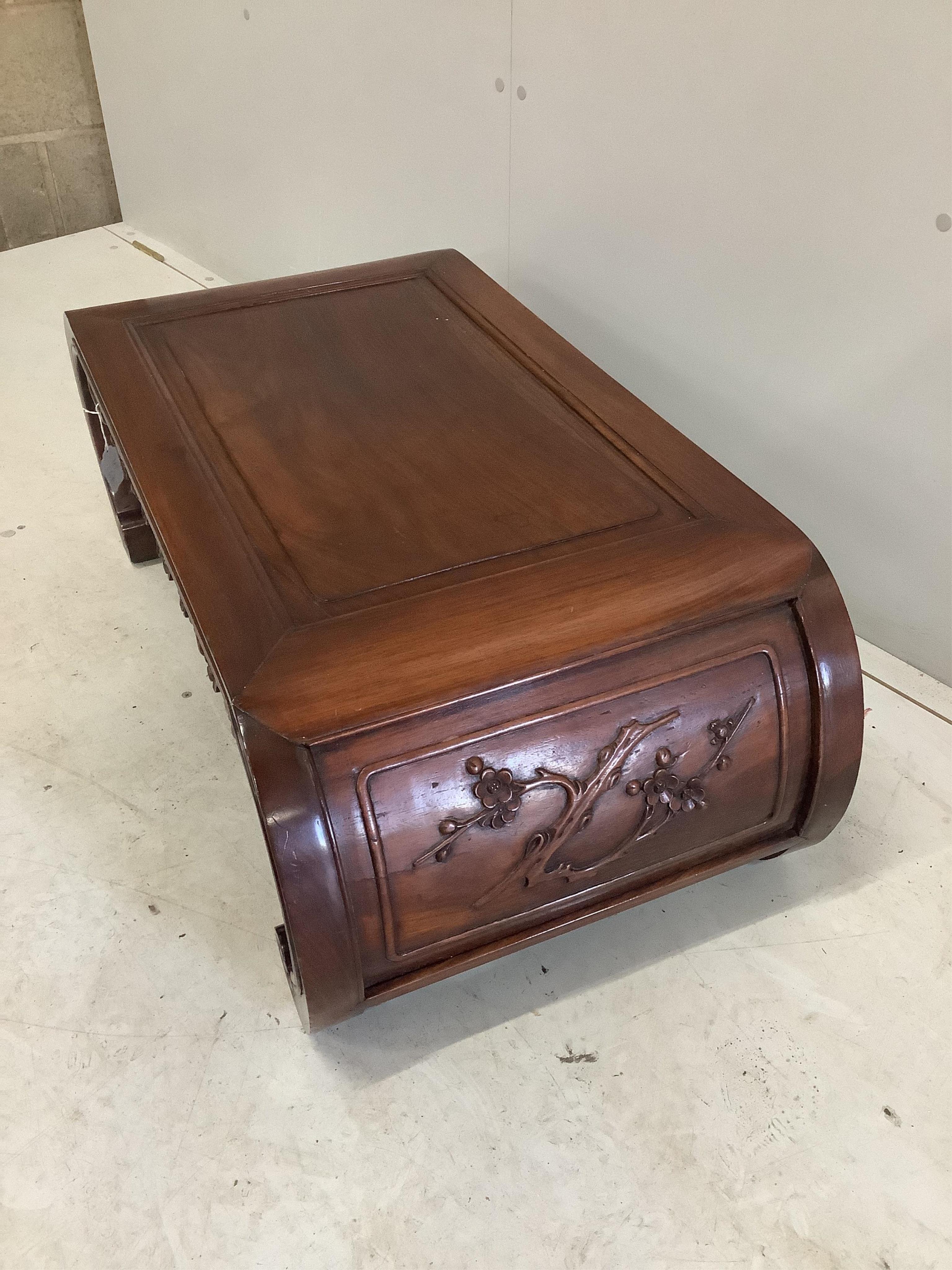 An early 20th century Chinese hardwood opium table, width 88cm, depth 46cm, height 33cm. Condition good.